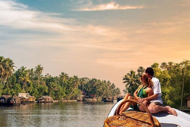 Couple enjoying a canoe ride through Kerala backwaters