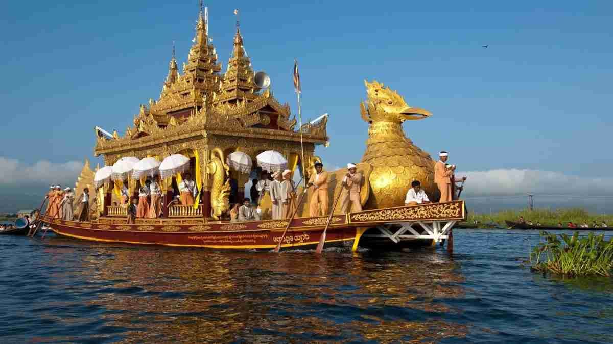 Kerala houseboat decorated with golden ornaments on the backwaters