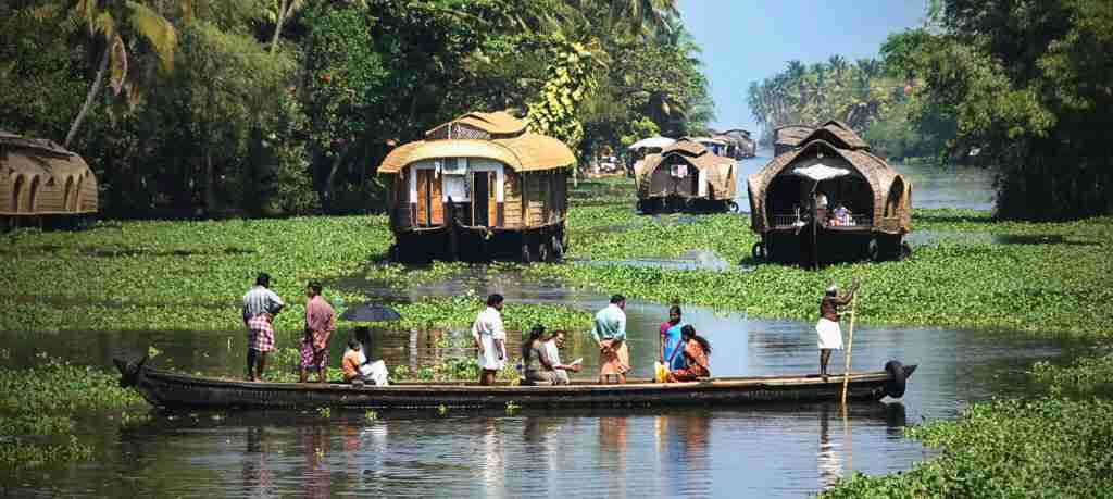 Traditional Kerala boat carrying passengers through the backwaters